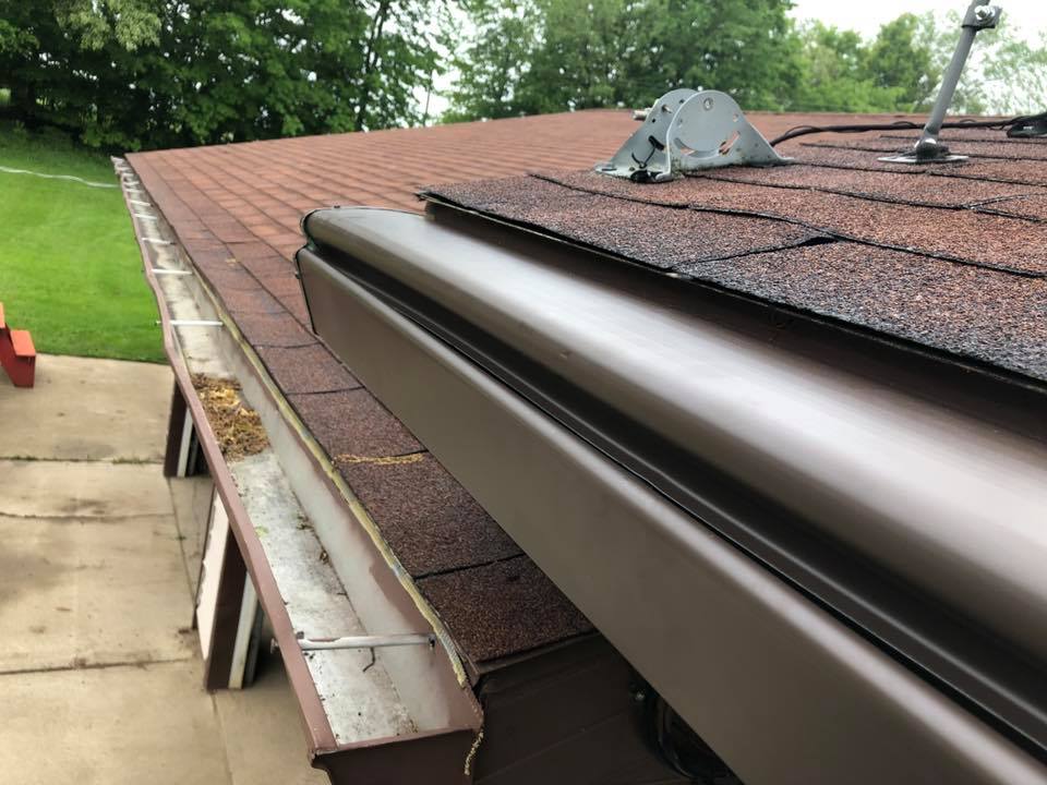 Comparison of older gutters and professionally installed K-Guard gutters on a West Michigan home