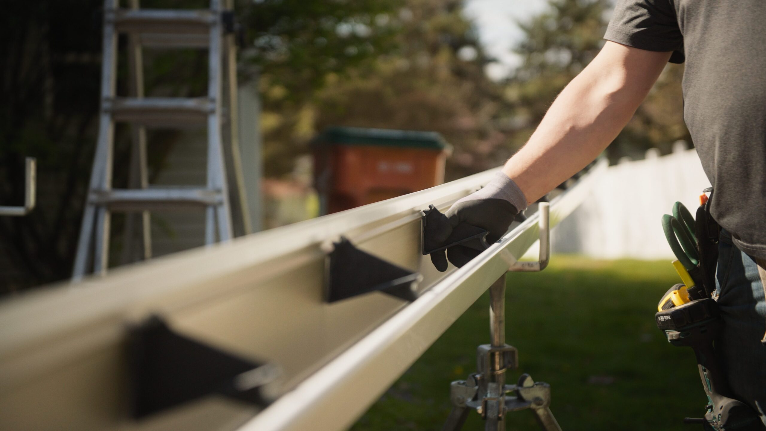 K-Guard installer working on a gutter system